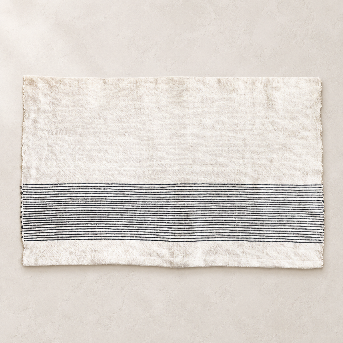 Riviera Handwoven Cotton Bath Mat — studio view